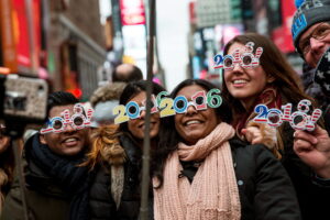 NEW YORK, NY - DECEMBER 31:  Tourists from Holland take a selfie while waiting to celebrate new years in Times Square on December 31, 2015 in New York City. The New York Police Department will have more than 6,000 officers in the Times Square area, including more than 1,100 officers who graduated from the police academy on Tuesday. It will be the largest such deployment of police in New York City ever.  (Photo by Andrew Burton/Getty Images)