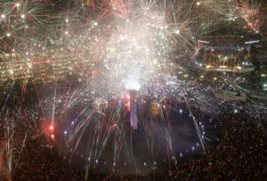 Fireworks explode as thousands of people gather to watch, in the main business district on New Year's Eve in Jakarta, Indonesia, late Thursday, Dec. 31,2015.(AP Photo/Achmad Ibrahim)
